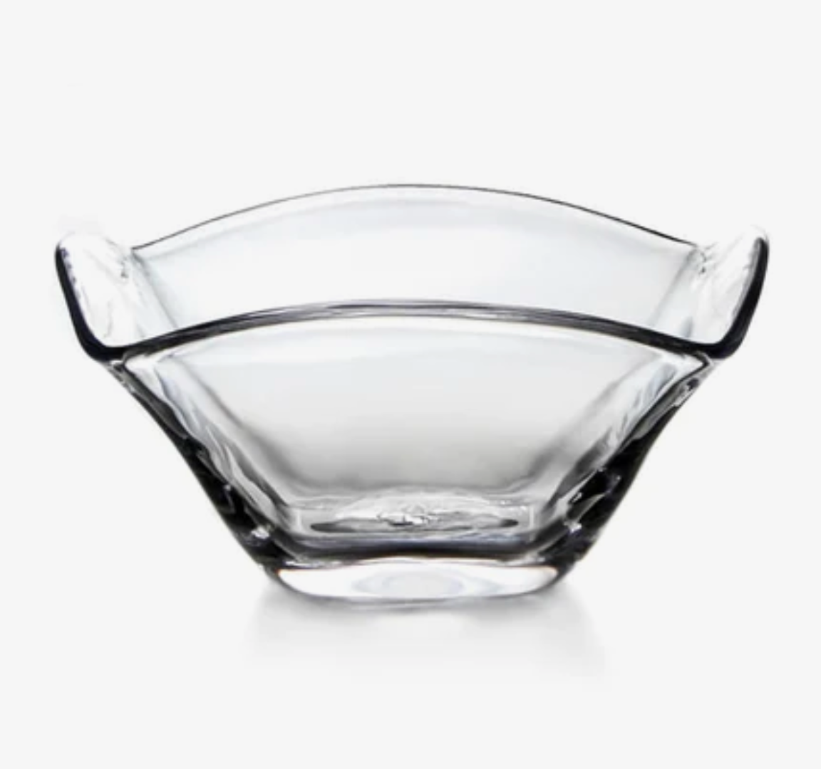 The Simon Pearce Woodbury Bowl is a clear handblown glass bowl with flared sides and gently curved edges, shown against a white background.