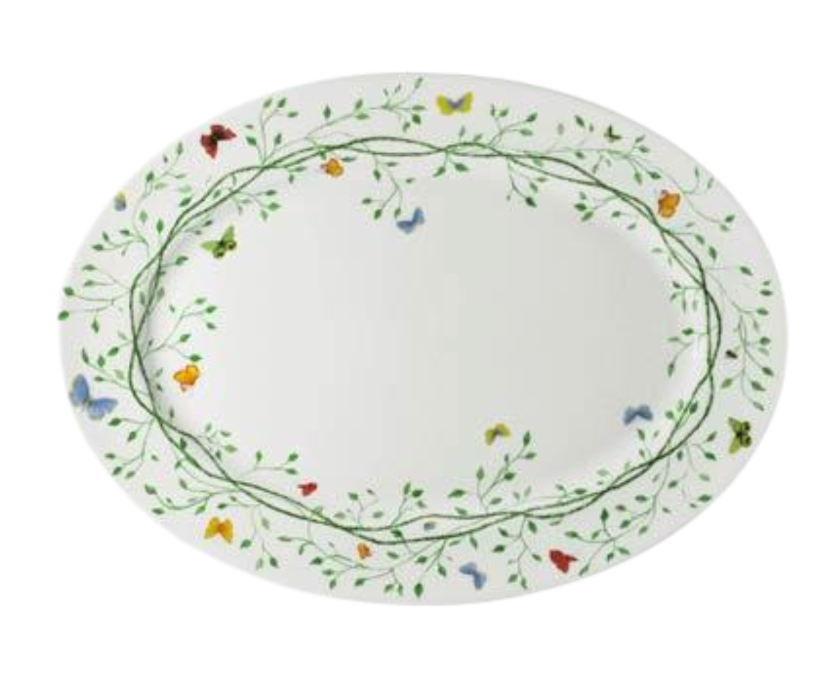 The Raynaud Histoire Naturelle Dinnerware features an oval white plate with a green vine border and colorful butterfly motifs—red, orange, yellow, green, and blue—showcasing French excellence at your table.