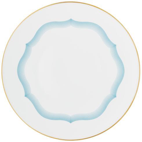 The Aura Dinnerware by Raynaud features a round white plate with a thin gold rim and light blue wavy scalloped border, paired with a plain center to highlight its contemporary design.