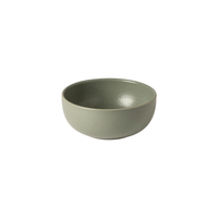 A minimalist, round, light green ceramic bowl from the Pacifica Dinnerware Artichoke collection by Casafina/Costa Nova, showcasing a smooth matte finish and capturing the subtle sophistication of Costa Nova Dinnerware, displayed against a white background.