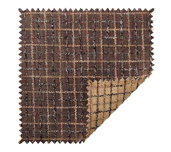 A Boucle Reversible Placemat in Brown / Multi, shown as a square fabric swatch with pinked edges, featuring a brown plaid pattern on one side and a solid tan texture on the reverse.