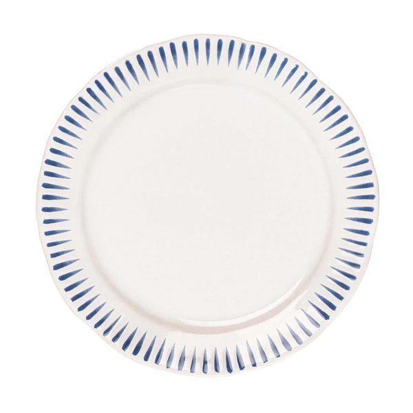 The Juliska Sitio Stripe Dinnerware features a round white ceramic dinner plate with a scalloped edge and evenly spaced Delft blue stripes radiating from the rim.