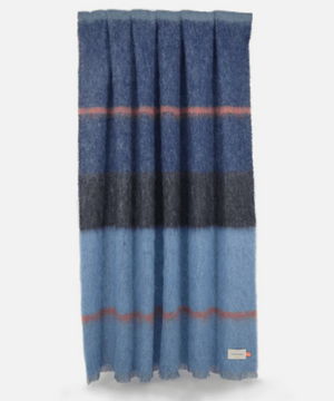 The Boher Extra Large Throw features wide horizontal stripes in shades of blue, grey, and rust with contemporary styling.