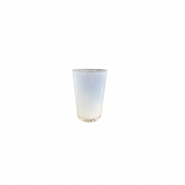 The Dynasty Cups Cotton by Gary Bodker is a hand-blown glass piece filled with cloudy white liquid, showcased on a plain white background to emphasize its minimalist design.
