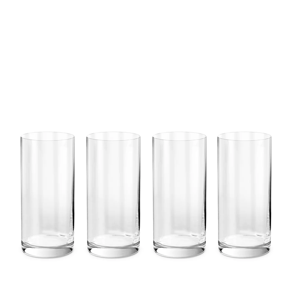 Four empty, clear tumblers from the L'Objet Iris Drinkware Collection are arranged in a straight line on a white background.