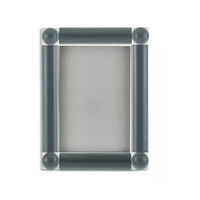 The Tizo Corner Ball Crystal Frame Grey is a rectangular 5x7 photo frame with thick, dark grey cylindrical borders and rounded corners. Elegant and empty, it highlights its blank inner area against a white background.