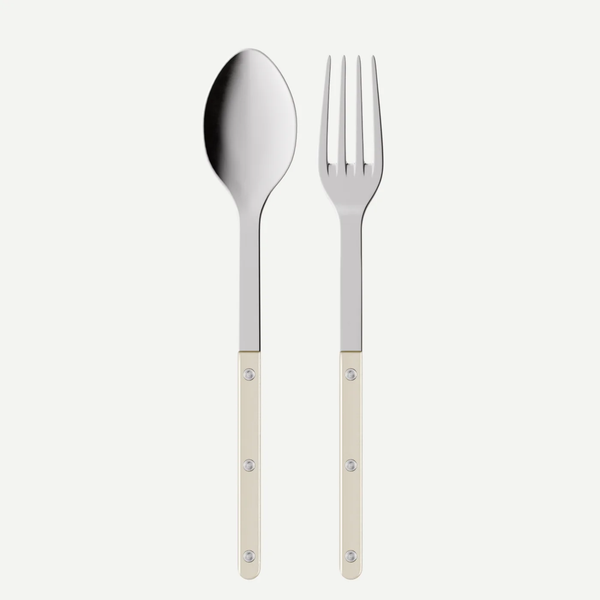 The Bistro Pearly Serving Set by Sabre features a metal spoon and fork with mother of pearl handles and rivets, displayed side by side on a plain white background.