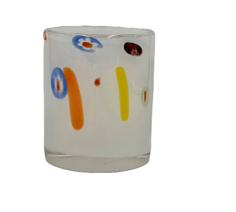 The Abigails Torcello Stripes DOF - White is a mouth-blown clear glass tumbler featuring colorful abstract stripes and flower-inspired patterns in blue, red, orange, and yellow reminiscent of Italian-style designs, shown against a plain white background.