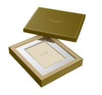 A Christofle America Stainless Steel Frame is shown in an open matching box, with the Christofle name visible on both the frame insert and box lid. The background is white.