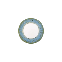A Jaune De Chrome Nymphea Dinnerware round ceramic plate with a white center, wide blue rim speckled with darker spots, and a thin olive green edge is shown on a white background.