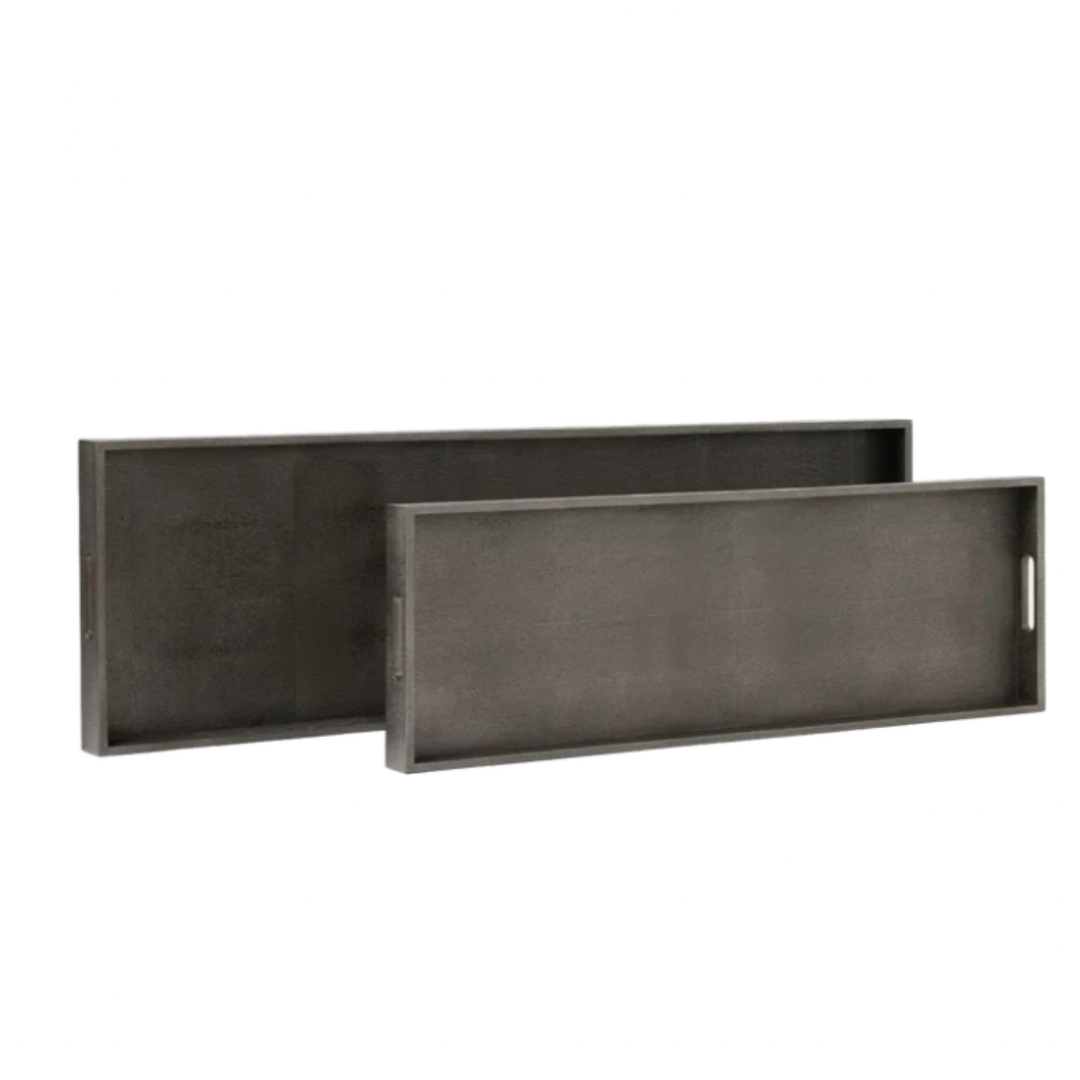 Two rectangular smoke Emery Console Tray Smoke trays with faux shagreen texture and cutout handles, one placed slightly behind and higher than the other.