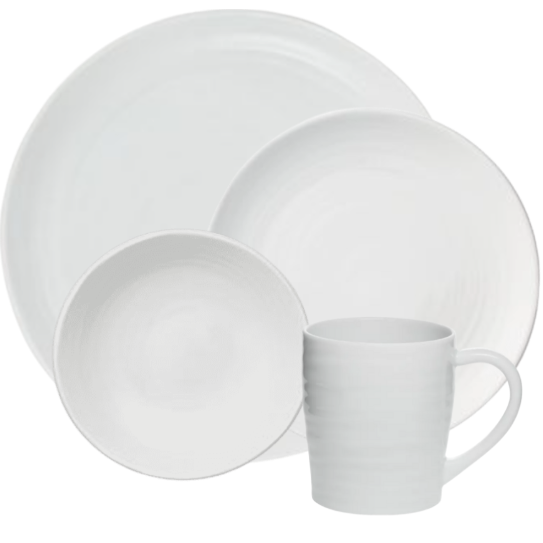 The Bernardaud Origine Dinnerware White set includes a large dinner plate, salad plate, bowl, and mug in Limoges porcelain with a subtle textured pattern.