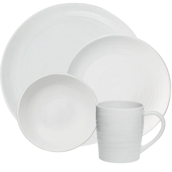 The Bernardaud Origine Dinnerware White set includes a large dinner plate, salad plate, bowl, and mug in Limoges porcelain with a subtle textured pattern.