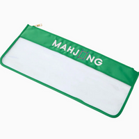 The Oh My Mahjong Tile Bags are green and clear zippered bags with "MAHJONG" in white letters, where a tile icon replaces the "I".