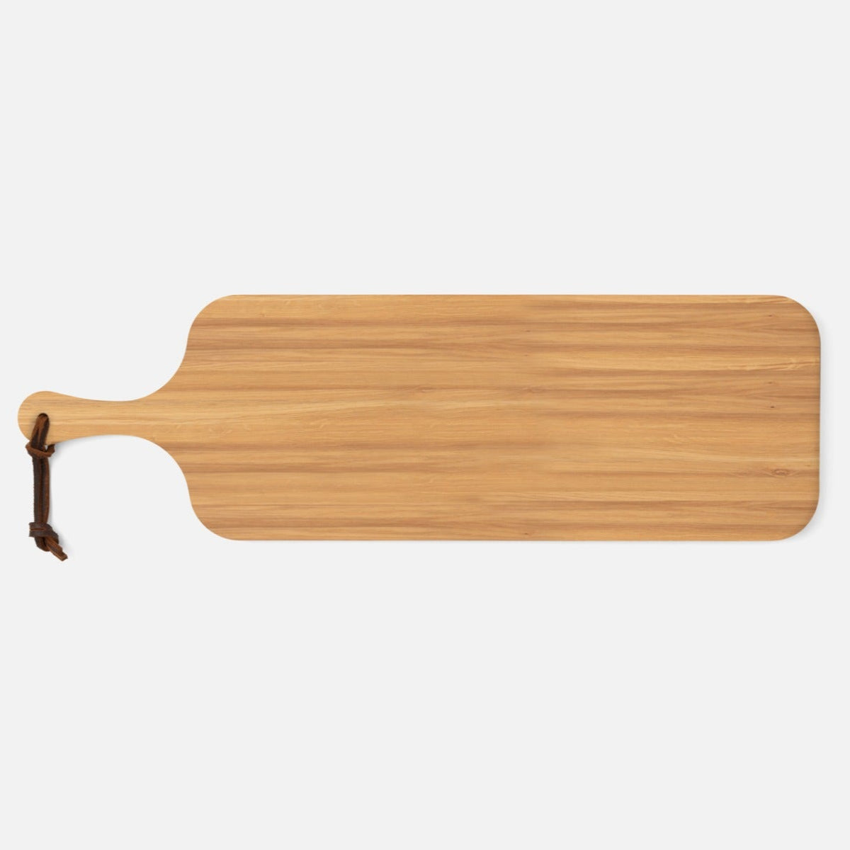 The Edmund Narrow Oak Serving Board by Blue Pheasant is a long, rectangular wooden tray with rounded corners and a dark leather handle—ideal as an elegant serving tray.