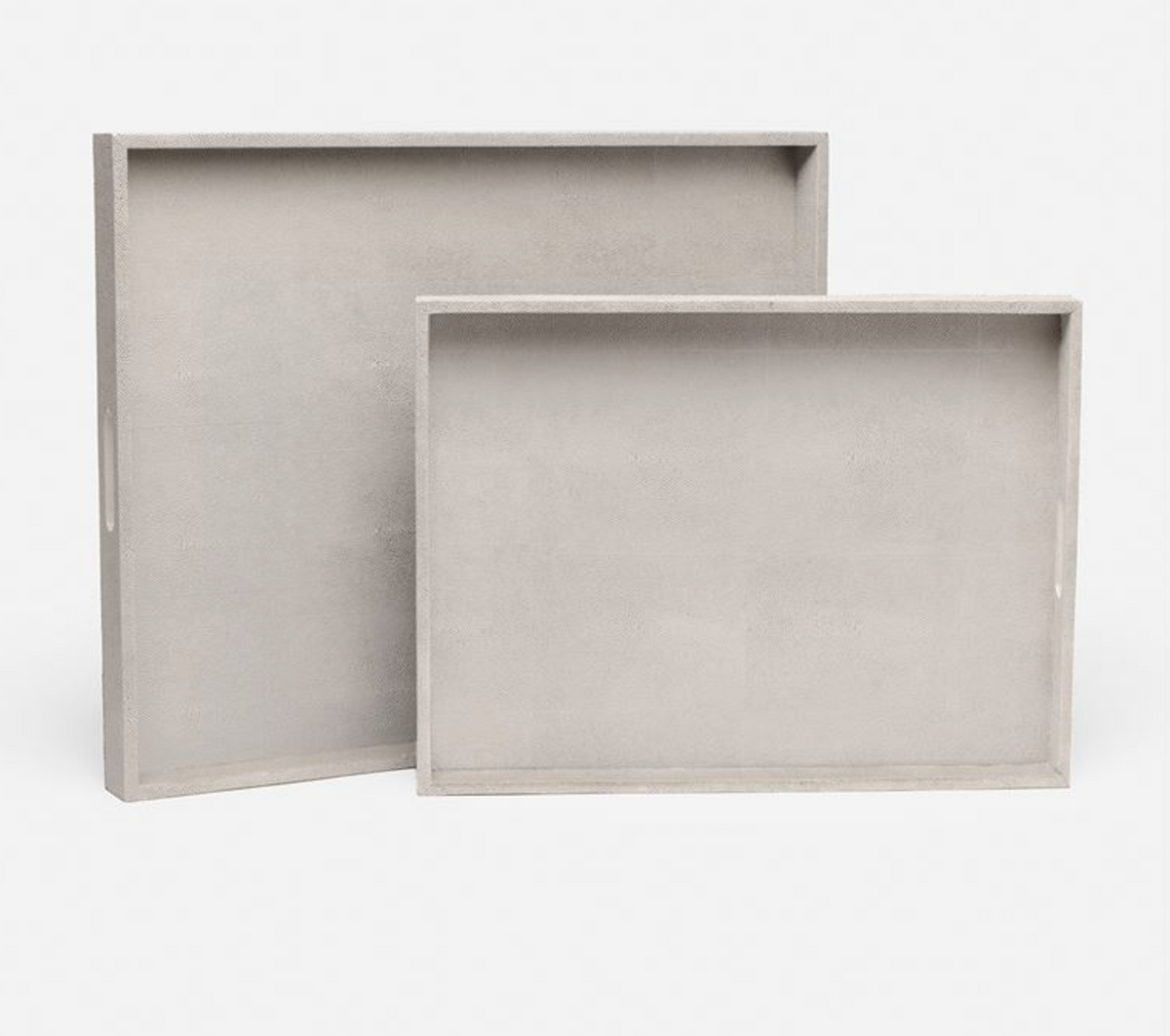 Two nested rectangular Emery Tray Rectangle French Grey decorative trays in grey, featuring convenient cut-out handles.