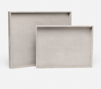 Two nested rectangular Emery Tray Rectangle French Grey decorative trays in grey, featuring convenient cut-out handles.