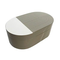 The Lacquer Stripe Box Grey by Von Gern Home features an oval shape with a smooth taupe finish and a lid adorned with modern white and taupe stripes—ideal for jewelry storage or as stylish home decor.