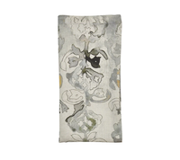 The Kim Seybert Giverny Napkin Set of 4 features rectangular, folded napkins with a gray, black, and muted yellow floral pattern on a light beige background inspired by Monet.