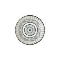 White Philippe Deshoulieres BIA Arcades Platinum Dinnerware plate with a silver, petal-like pattern radiating from a central ring.