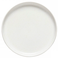 The Casafina/Costa Nova Pacifica Salt Dinnerware features a plain, round, white ceramic plate with a smooth matte finish and slightly raised rim—an elegant addition to any table setting.