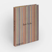 A book titled "Paul Smith" by Phaidon/Hachette with a cover of multicolored vertical stripes for design inspiration, "Paul Smith" in black cursive on the front, and matching spine with brand names printed in black.