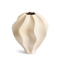 The Douro Vase Oat - Medium by L'Objet is a modern beige porcelain vase with a matte finish and sculptural, wavy design. Its narrow opening and undulating surface bring elegant style to any space.