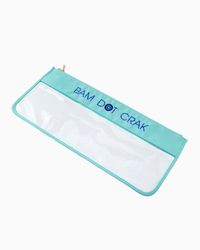 The Oh My Mahjong Mahjong Tile Bags feature turquoise and clear material with "BAM DOT CRAK" embroidered in blue—perfect for carrying your mahjong tiles in style.