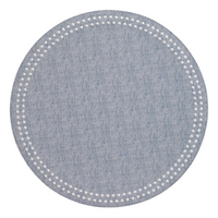 The Bodrum Pearls Round Placemat Set of 4 in light blue features a subtle textured design and a border of small white dots, adding modern charm to any table—perfect for an elegant, embroidered placemat style.