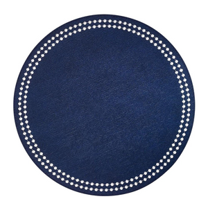 The Bodrum Pearls Round Placemat Set of 4 in dark blue is made from phthalate-free vinyl, featuring a textured surface and a circle of small white dots near the edge.