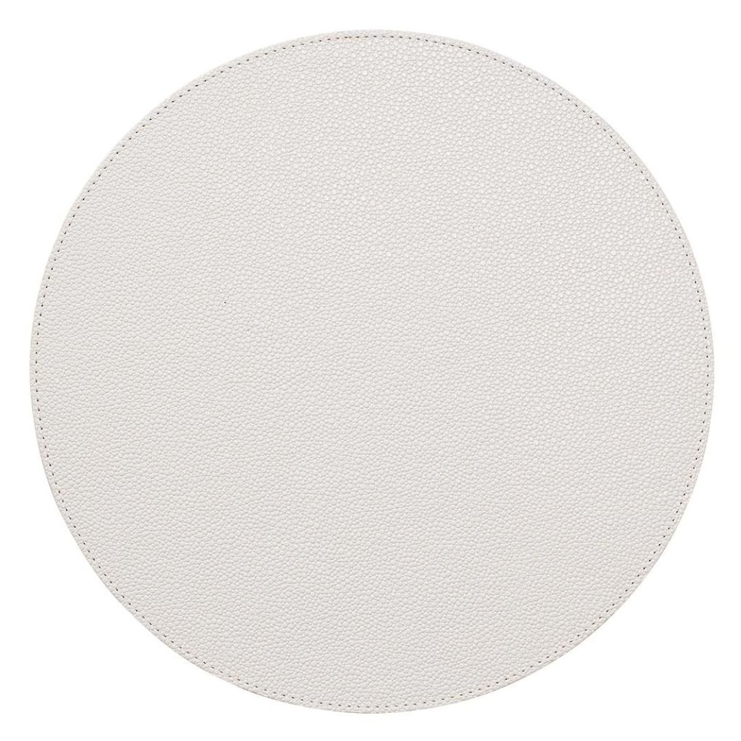 A set of four Kim Seybert Pebble Placemats features a round, light gray or off-white textured surface, displayed on a white background.