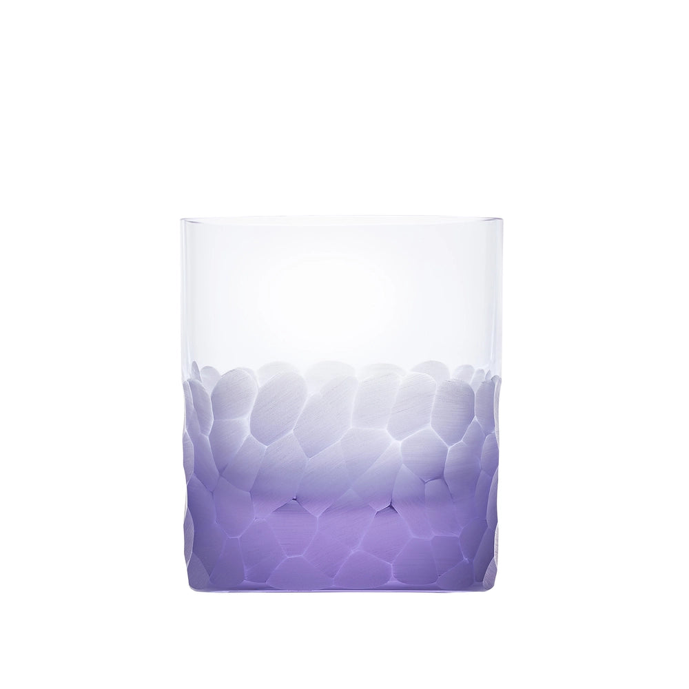 The Pebbles DOF 370 ml by Moser is a hand-blown, lead-free Czech crystal whisky tumbler featuring a textured frosted gradient in light purple on the lower half and a smooth, transparent upper half.