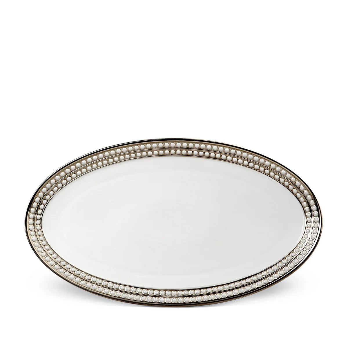 An oval white Perlée Platinum Dinnerware platter by L’Objet, featuring a raised beaded border and platinum rim, is shown from above on a plain white background.