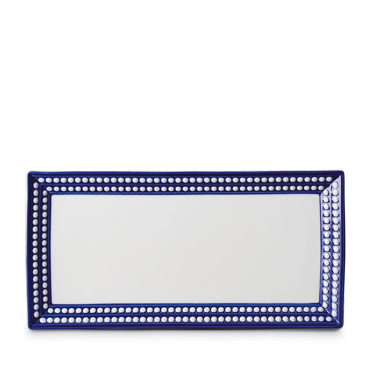 The Perlèe Blue Dinnerware rectangular ceramic platter by L'Objet features a white center, a blue border with white dots, and is inspired by classic blue and white dinnerware, displayed on a plain white background.