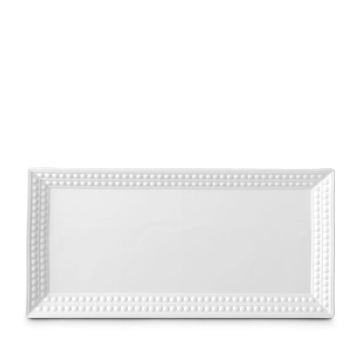 The Perlée White Dinnerware by L'Objet features a rectangular white Limoges porcelain platter with a beaded border—ideal as a charger plate for elegant table settings, shown on a plain white background.