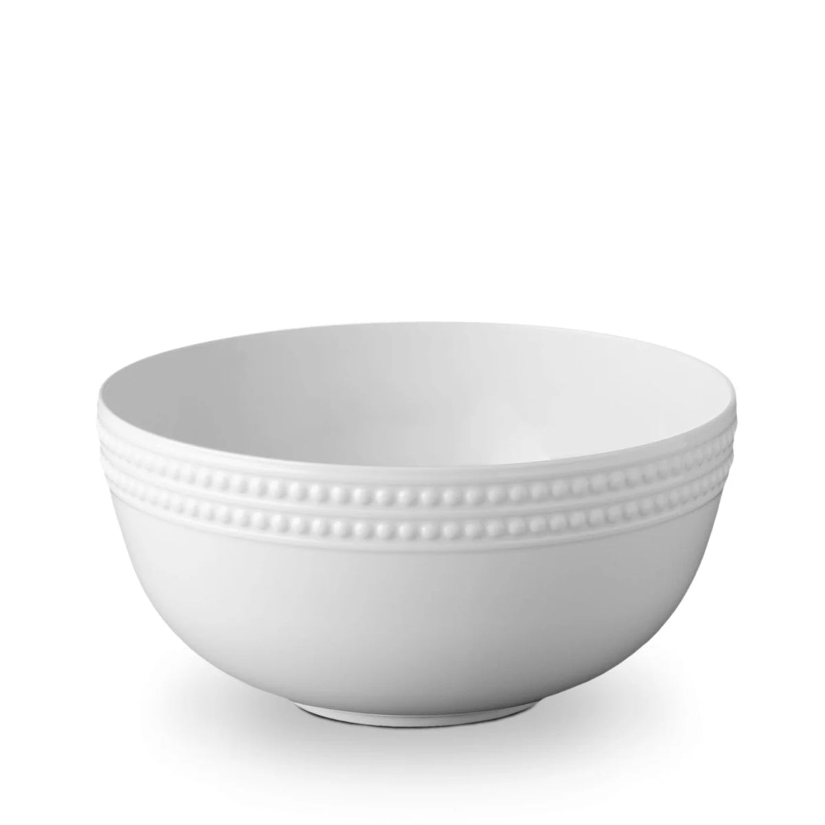 The Perlée White Dinnerware by L'Objet is a white ceramic bowl featuring a smooth finish and a decorative beaded pattern around the upper edge, set against a plain white background.