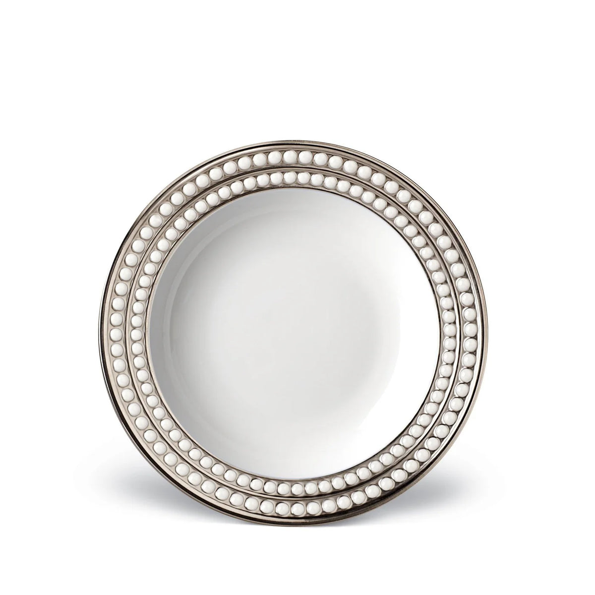 The L'Objet Perlée Platinum Dinnerware plate is round, white porcelain with a platinum rim and three rows of raised white beads on the border. Its glossy center completes the elegant design.