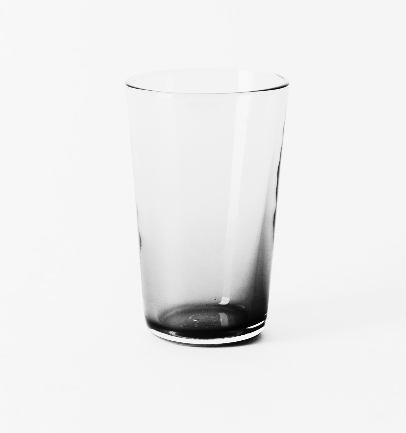 The Gary Bodker Everyday Glass Clear is a transparent glass tumbler with a slight tint, elegantly displayed on a white background—ideal drinkware for daily use.