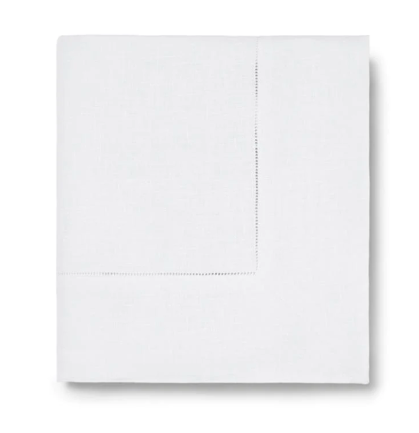 The Sferra Festival Tablecloth, featuring a subtle stitched border detail, is neatly displayed against a plain white background.