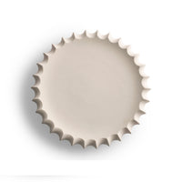The Phoebe Bowl 15″ by FlowDecor Inc. is a round, off-white ceramic piece with a wavy edge—ideal as a decorative display or stylish catch-all, shown from above on a plain white background.