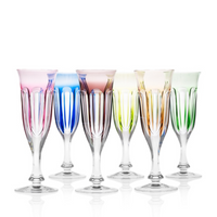 Six Moser Lady Hamilton Champagne Glasses (140ml), each hand-cut and tinted in pink, blue, purple, yellow, orange, and green with tall stems, evoke elegance on a white background.