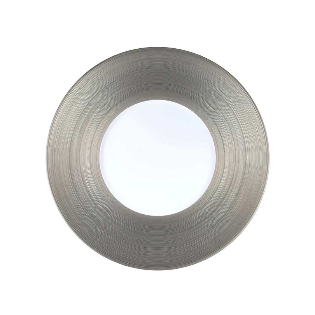 A brushed nickel recessed light fixture with a circular design, perfect for illuminating refined table settings featuring JL Coquet's Hemisphere Dinnerware Platinum.