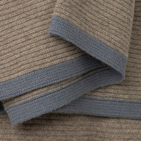 Folded Yak Ribbed Throw - Platinum & Slate in taupe with a ribbed texture and a slate blue border.