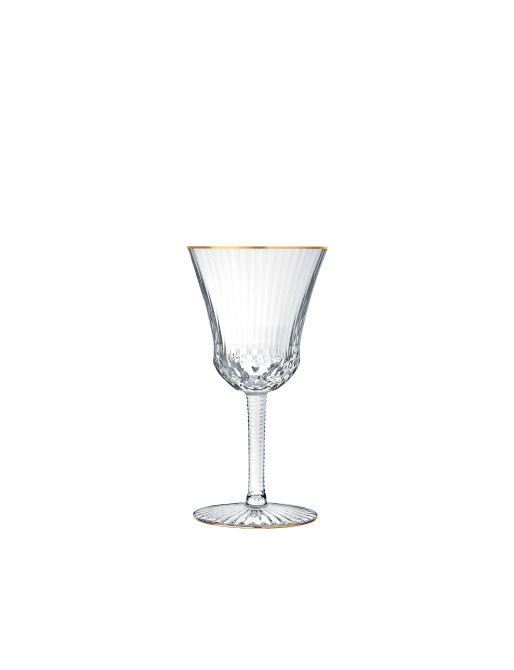 The Apollo Stemware by Saint-Louis/Hermès is a clear crystal wine glass with vertical ribbed detailing, a thin stem, and a gold rim—mouthblown, hand-cut, and shown upright on a white background.
