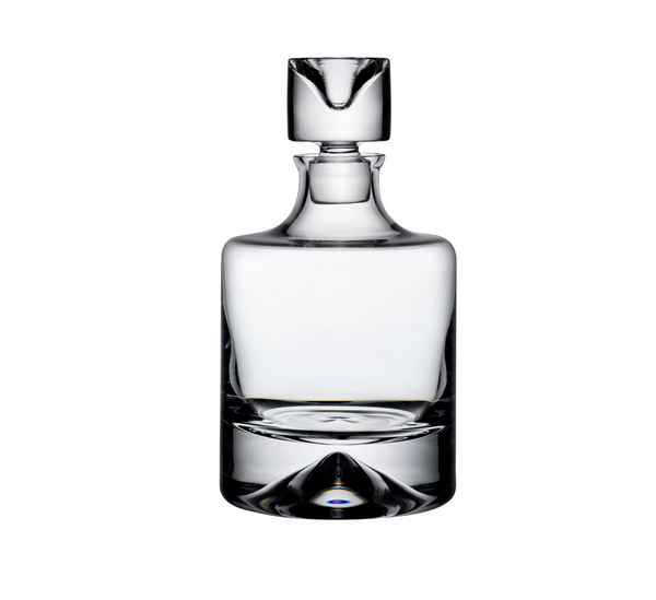 The No.9 Whiskey Decanter by Nude Glassware features a modern, rounded design with a thick base and matching glass stopper. Photographed empty against a white background, this clear glass decanter offers sleek style and contemporary elegance.