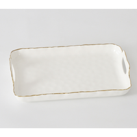 The PAMPA BAY Portofino Handle Rectangle Tray is a white porcelain serving tray with wavy edges, handles, a gold-rimmed border, and a subtle textured surface for an elegant and functional presentation.