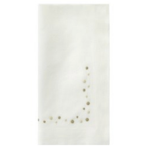 The Bodrum Dots Napkin Set of 4 in beige features a subtle curved line of small gold dots, adding elegance and style to any cloth napkin collection.