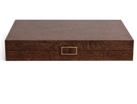 The Malaga 19" Backgammon Set by Zodax showcases a rectangular wood veneer box with a swirling grain pattern and a square central handle. Opening to reveal a luxurious leather playing surface, this elegant and portable board game display is perfect for enthusiasts. The set stands out beautifully against a white background.