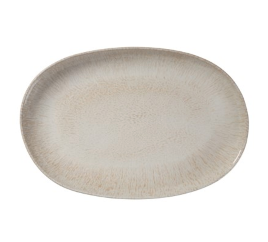 The Merritt Reactive Glaze Melamine Beige Oval Serving Tray (17.25") features a stoneware-inspired look with light beige speckles and a subtly textured finish, ideal for outdoor serving.