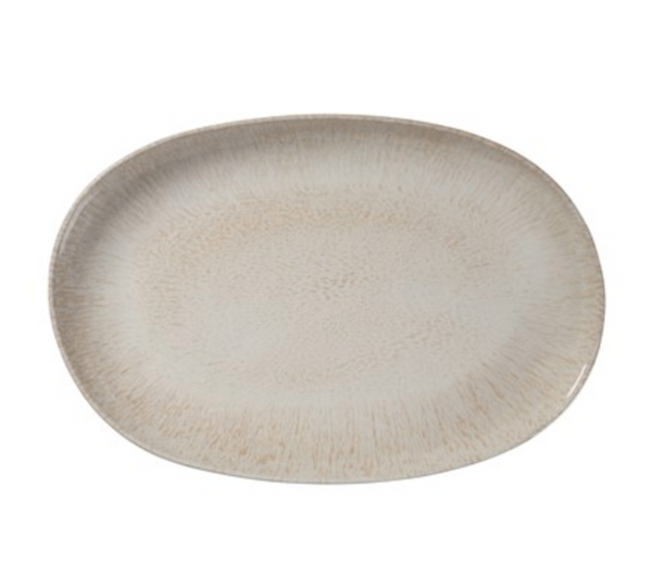 The Merritt Reactive Glaze Melamine Beige Oval Serving Tray (17.25") features a stoneware-inspired look with light beige speckles and a subtly textured finish, ideal for outdoor serving.